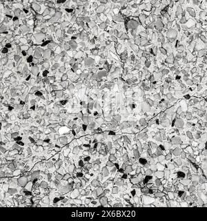 Black and white color stone mosaic floor. Old beautiful polished stone wall for background Stockfoto