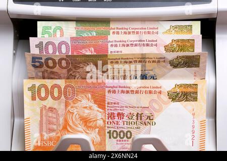 Hongkong-Geld - Dollar in einem Zählautomaten Stockfoto