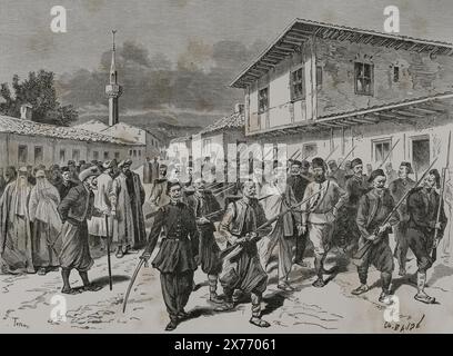 Die Östliche Frage. Serbisch-Türkische Kriege (1876-1878). Serbien erklärte dem Osmanischen Reich am 30. Juni 1876 den Krieg. Der Aprilaufstand 1876 wurde von den türkischen Behörden in Bulgarien mit starker Repression erlebt. Serbische Aufständische wurden von den Türken ins Gefängnis gebracht. Stich von Charles Baude. "La Guerra de Oriente" (russisch-türkischer Krieg). Band II. 1877. Stockfoto