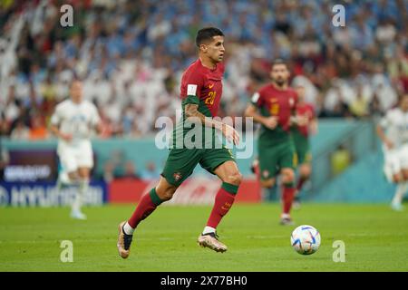 Lusail, Katar. November 2022. Joao Cancelo in Aktion während des Spiels zwischen Portugal und Uruguay, Gruppe H, FIFA Fussball-Weltmeisterschaft Katar 2022. Stockfoto