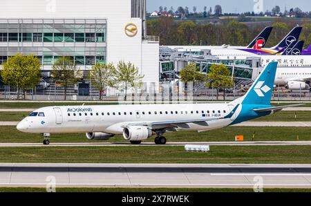 München, 6. April 2024: Ein Embraer 195LR von Air Dolomiti Taxis zur Start- und Landebahn am Flughafen München. Registrierung I-ADJK. (Foto: Andreas Haas/d Stockfoto