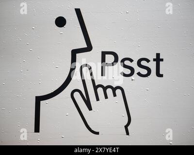 Eine minimalistische Schwarz-weiß-Illustration eines Gesichts und einer Hand, die mit dem Wort „Psst“ in fetten Buchstaben für Stille sorgt. Stockfoto