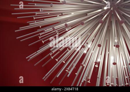 Foto einer Gruppe weißer Metallstäbe auf rotem Hintergrund Stockfoto