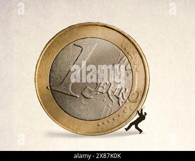 Geschäftsmann wird unter einer übergroßen 1-Euro-Münze zerquetscht Stockfoto