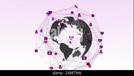 Bild eines Netzwerks digitaler Symbole über sich drehender Globus vor rosafarbenem Hintergrund Stockfoto