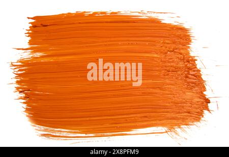 Isolierter, orangefarbener Acrylfarbe auf weißem Hintergrund mit auffälliger Textur Stockfoto