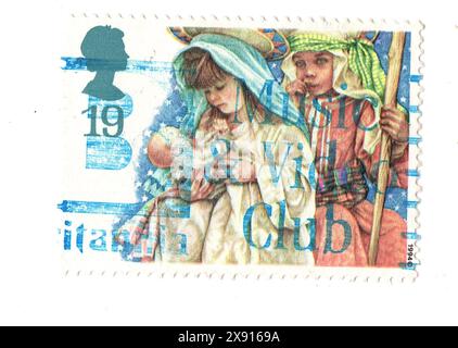 Eine alte Weihnachtsmarke aus Großbritannien, isoliert auf weißem Hintergrund. Stockfoto