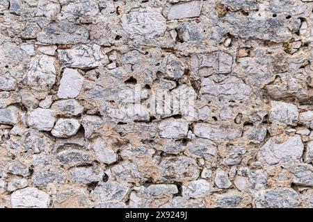 Textur einer alten Mauer aus Stein Stockfoto