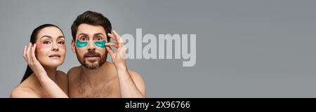 Liebevolles Paar, mit Augenflecken, posiert zusammen in einer zauberhaften Präsentation. Stockfoto