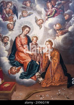 In diesem Gemälde von Francisco Pacheco aus dem Jahr 1628 kniet der Heilige Agnes vor der Jungfrau Maria und dem Kind, umgeben von Engeln. Stockfoto