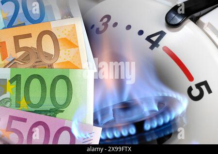 Heizung und Gasflamme als Symbolbild für Energie- und Nebenkosten mit Euro Geldscheinen - FOTOMONTAGE *** Heating and GA Stockfoto