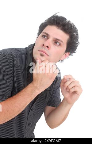 Verwirrter und verärgerter Mann auf weißem Hintergrund Stockfoto