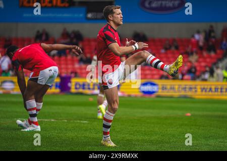 Salford, Manchester, Großbritannien. Juni 2024. Super League Rugby: Salford Red Devils gegen London Broncos im Salford Community Stadium. CHRIS ATKIN vor dem Spiel warm Up. James Giblin/Alamy Live News. Stockfoto