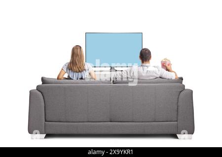 Rückansicht eines Mannes und einer Frau, die fernschauen und auf einer Couch sitzen Stockfoto