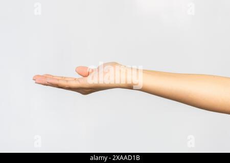 Eine ausgestreckte Hand, die in einer Nahaufnahme nach vorne streckt Stockfoto