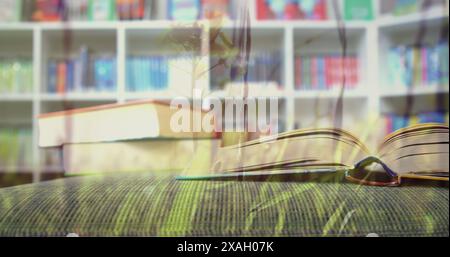 Bild von Gras über Büchern in der Bibliothek Stockfoto