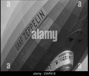 Graf Zeppelin fliegt über uns, 1929. Luftschiffe - viele Leute dachten, sie hätten eine große Zukunft. Nach ihren leichteren Jobs im Ersten Weltkrieg entwickelten die Deutschen im Frieden weiterhin Luftschiffe. Es gab eine Menge zugunsten von Luftschiffen, also sagten die Leute, die an sie glaubten. Zum Beispiel gab es Platz in ihnen... alle modernen Annehmlichkeiten, warmes und kaltes Wasser und alles Gas, das sie vielleicht brauchen konnten. Aus „Time to Remember – 1929 The Time of the House at Bognor“ – Reel 3; ein Dokumentarfilm über die Welt im Jahr 1929. Krankheit von König Georg V. &amp; wirtschaftliche Depression. Stockfoto