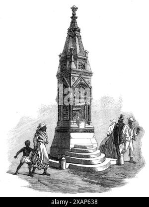 Trinkbrunnen bei Barbadoes, 1865. Der Wasserbrunnen in Bridgetown, der von Mr. J. F. Bentley, Architekt, entworfen wurde, wird geschickt in einer Adaption des frühen englischen Stils der Gotik behandelt; und Mr. T. Earp hat die Struktur, die 24 Fuß groß ist, geschickt ausgeführt. Hoch und hauptsächlich aus Portland-Stein, das Becken besteht aus grauem Derbyshire-Marmor, die Säulen aus grünem Serpentinmarmor aus Cornish... mit einer Corona aus Portland-Stein... die Zwischenräume zwischen den Säulen, den Vierfachfolienpaneelen und dem Gesims sind mit den Enkaustikfliesen von Minton und Maw in harmonisch variiertem Farbkolben eingelegt Stockfoto