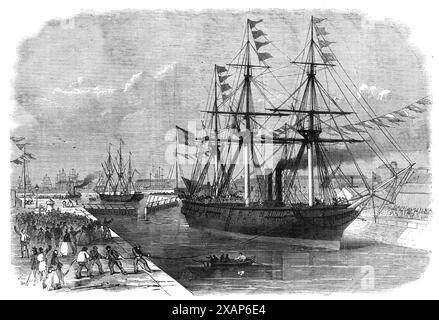 Eröffnung der neuen Docks in Millwall, [London], am Samstag letzten 1868. „Die Schleuse... ist mit 450 m die mit Abstand größte in London. Lang und 80 Fuß Breit. Es gibt drei Paar Schleusentore am Eingang, die es Lastkähnen und kleinen Schiffen ermöglichen, zu jeder Zeit ein- und auszusteigen, während die Wassertiefe von tide...its 28 Fuß beträgt. In der Mitte. Dies ist die größte Wassertiefe, die am Eingang eines jeden Docks in London angebracht ist... in der Umgebung, auf den Kais, befindet sich eine ausgezeichnete Lagerunterkunft, und es wurden Krane errichtet, die von 35 cwt heben können. Auf 15 Tonnen, mit hydraulischer Kraft... Insid Stockfoto