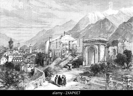 Neue Überlandverbindung nach Indien: Mont Cenis Railway – Susa, im Piemont, 1869. Gravur aus einer Skizze „... von unserem Spezialkünstler, der beauftragt wurde, die gesamte Linie der New Overland Route und des Suez Canal entlang zu gehen...[die Abbildung zeigt] die malerische antike Stadt Susa, die erste italienische Stadt, in die der Reisende aus Frankreich kommt. Er ist der nordwestliche Endpunkt des italienischen Eisenbahnsystems. Hier verläuft die Alta-Italia-Linie etwa 30 Meilen nach Turin... die Lage von Susa, am Eingang der Bergschlucht und am Ufer der Dora, die in den Po bei Tur mündet Stockfoto