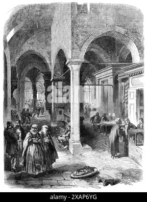 Der Basar in Konstantinopel, 1869. "Diejenigen, die nach einigen Jahren der Abwesenheit Konstantinopel bei der letzten Tour des Prinzen und der Prinzessin von Wales nach Osten wiederbesucht haben, müssen von einer sehr allgemeinen Änderung der Kleidung und Gewohnheiten des türkischen Volkes, insbesondere der Ladenbesitzer, überrascht worden sein. Anstatt Turban und loses Gewand zu tragen, mit dem ehrwürdigen Bart eines orientalischen Ältesten, und im Kreuz auf dem Teppich der Geduld hocken, um auf die Annäherung seiner Kunden zu warten, ist der moderne türkische Kaufmann auf dem Basar von Stamboul [dh Istanbul] ein lebendiger junger f Stockfoto