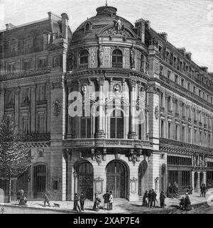 Das neue Theater des Vaudeville, Paris, 1869. Das neue Vaudeville Theatre, an der Kreuzung des Boulevard des Italiens mit dem Boulevard des Capucines, ist ein eindrucksvolles und schönes Gebäude. Der Architekt, M. Magne, hatte einen kleinen Platz, um zu arbeiten, aber er hat zweifellos einen Erfolg erzielt. Die Fassade ist in Form einer Rotunde zwischen zwei hohen Häusern und wird von einer Kuppel überragt, deren dekorative Skulptur ihr einen feinen Effekt verleiht. An der schrägen Front ist eine Figur von Apollo... die Pilaster, die die Fassade von den Basen trennen, sind sur Stockfoto