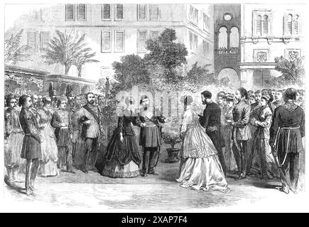 Der Prinz und die Prinzessin von Wales in Ägypten: Der Vizekönig stellt Mrs. Stanton der Prinzessin vor, 1869. Der Vizekönig, in Anwesenheit seiner Minister, empfing seine Gäste auf dem Bahnsteig in Kairo, etwa 30 Meter vom Garteneingang des Palastes entfernt. Mr. Reade, verstorbener britischer Konsul in Kairo, sein Nachfolger, Mr. Rogers, und das Konsularpersonal, zusammen mit Mrs. Stanton und einigen anderen Damen, waren am Empfang anwesend. Der Prinz von Wales trug die scharlachrote Uniform eines Generals, mit dem Stern und dem Schärpe des Ordens der Medjidieh und dem Kragen und Abzeichen des Order of the Bath. Der Vizekönig Stockfoto