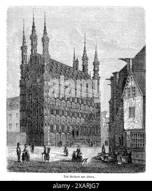 Diese antike schwarz-weiße Gravur zeigt das Rathaus von Leuven, vom belebten Marktplatz aus gesehen. Die Gravur fängt die komplizierte gotische Architektur des Gebäudes mit seinen reich verzierten Fassaden mit zahlreichen Statuen und Ziergiebeln ein. Das Rathaus ist ein markantes Beispiel für brabantinischen gotischen Stil, was dieses Stück zu einer fesselnden visuellen Darstellung der belgischen architektonischen Eleganz und historischen Bedeutung macht Stockfoto