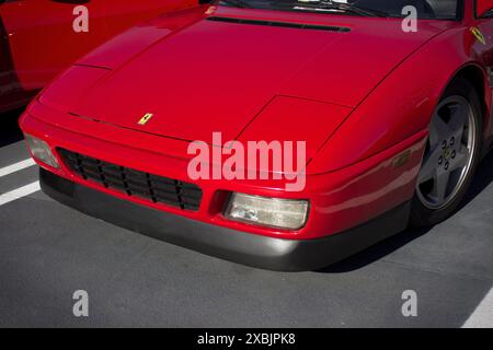A cropped, front, 3/4 view of a Ferrari 348 parked. Stockfoto