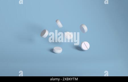 3D-Illustration von mehreren weißen Tabletten mit geritzten Linien, die auf einem hellblauen Hintergrund schwebend sind und Gesundheit und Medikamente darstellen. Stockfoto