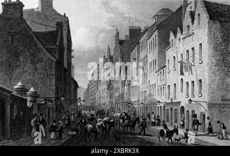 The Canongate, Edinburgh, mit Blick nach Westen, graviert von W. Tombleson. Es stammt von einem Stich aus dem Jahr 1832, der aus einer Aquarellzeichnung von Thomas H. Shepherd (1793–1864) stammt. Zu der Zeit, 1832, war Wilhelm IV. König, etwa fünf Jahre bevor Königin Victoria den Thron bestieg. Dies und andere, die ich in der Serie habe, wurden verwendet, um die architektonischen Ähnlichkeiten zwischen Athen und Edinburgh (Schottland) und seiner Umgebung zu dieser Zeit zu veranschaulichen. Hinweis: Einige der Originale hatten Foxing, was auf den Fotos als etwas dunklere Flecken erscheinen kann. Stockfoto