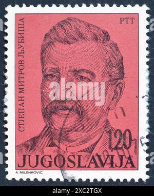 Von Jugoslawien gedruckte gestempelte Briefmarke, die Porträt des Schriftstellers Stjepan Mitrov Ljubiša (1824-1878) zeigt, um 1975. Stockfoto