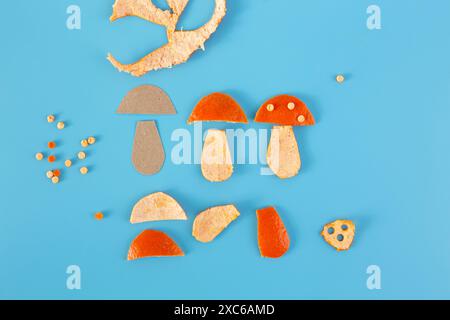 Wie man Pilzform aus Mandarinenschalen ausschneidet, einfache Dekorationsidee, Designelement, Tutorial, DIY Stockfoto
