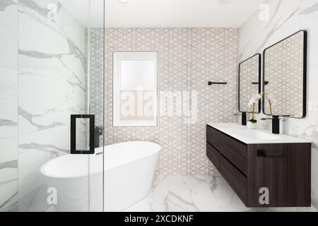 Ein Badezimmer mit einer Wand mit braunen und weißen Fliesen, Marmorboden und -Wänden, einem schwebenden Holzschrank und einer freistehenden Badewanne. Stockfoto