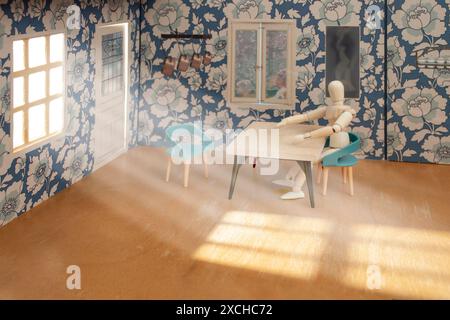 Das Modell aus Holz sitzt auf einem Stuhl, an einem Tisch in einem Puppenhaus mit Sonnenstrahlen, die aus einem Fenster projiziert werden Stockfoto