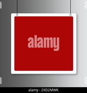 Hängendes rotes Schild mit einem leeren Platz für Text auf grauem Hintergrund. Stockfoto