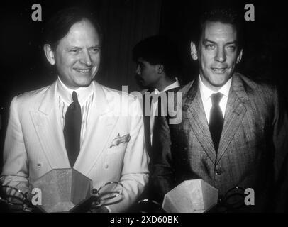 Donald Sutherland ist verstorben. Tom Wolfe und Donald Sutherland 1983 Foto: John Barrett/PHOTOlink /MediaPunch Stockfoto