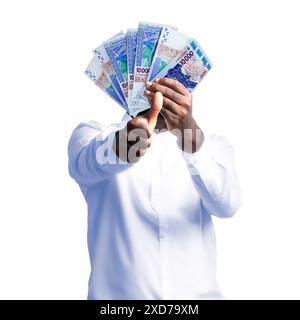 Schwarze Person, die westafrikanische CFA-Franc-Banknoten hält und Daumen zur Kamera hält. Hand hält westafrikanische Geldscheine, 3d gewordenes Geld Stockfoto