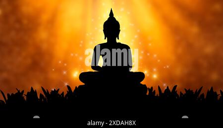 Buddha Statue Silhouette Buddha sitzt auf Lotusblume auf orangem Hintergrund Stockfoto