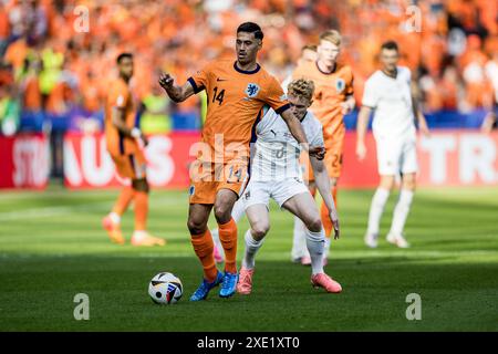 Berlin, Deutschland. Juni 2024. Tijjani Reijnders (14) aus den Niederlanden beim Spiel der UEFA Euro 2024 in der Gruppe D zwischen den Niederlanden und Österreich im Olympiastadion in Berlin Credit: Gonzales Photo/Alamy Live News Stockfoto