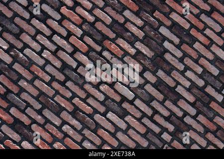 Backsteinwand Hintergrund. Rote, braune, schwarze alte Ziegelsteinmauerwerk Hintergrund. Steinstruktur für Architektur und Innenraum. Stockfoto