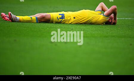 Stuttgart, Deutschland. Juni 2024. Fußball, UEFA Euro 2024, Europameisterschaft, Ukraine - Belgien, Vorrunde, Gruppe E, Spieltag 3, Stuttgart Arena, Heorhij Sudakov aus der Ukraine reagiert. Quelle: Tom Weller/dpa/Alamy Live News Stockfoto