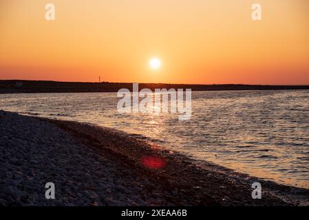 Sonnenuntergang am französischen Strand an der Küste von Aran Island in Co, Galway, Inishmore, Republica of Ireland Stockfoto