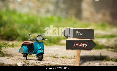 Wegweiser sind der direkte Weg zu vor- und Nachteilen Stockfoto