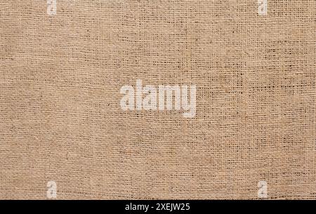 Sehr grobes, raues Gewebe aus Flachs, Jute oder Hanf. Hintergründe und Texturen Stockfoto