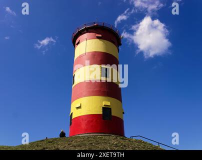 Der Leuchtturm ist eines der berühmtesten Wahrzeichen in Ostfriesland. Stockfoto