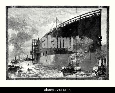 Eine alte Gravur des Starts des Great Eastern an der Themse, London, England, Großbritannien im Jahr 1858. Es stammt aus einem viktorianischen Geschichtsbuch aus dem jahr 1900. Die SS Great Eastern war ein von Isambard Kingdom Brunel entworfenes, mit einem Segelantrieb betriebenes Dampfschiff mit Schaufelrad und Schraubenantrieb, das von John Scott Russell & Co. In Millwall Iron Works gebaut wurde. Sie war das bei weitem größte Schiff, das jemals gebaut wurde, als sie startete. Starke Winde verhinderten den Start des Schiffes bei der Flut vom 30. Januar 1858, aber am nächsten Morgen startete ein neuer Versuch erfolgreich das Schiff. Stockfoto