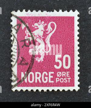 Stempel für annullierte Briefe, gedruckt von Norwegen, auf dem das Wappen steht, ungefähr 1919. Stockfoto