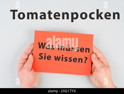 Die Worte Tomatenpocken, was Sie wissen müssen, stehen in deutscher Sprache auf einem Papier, Ausbruch des Virus in Indien, Ausbreitung von Infektionskrankheiten Stockfoto