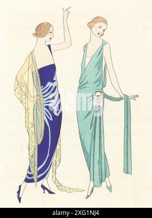 Modische Frau in Luxuskleidern, Paris, 1922. Abendkleid aus Saphirsamt und blonder Spitze von Madeleine et Madeleine. Boticelli: Kleid aus Mandelseidensamt, der Rock ist bedeckt und wird von einem Kristallmotiv von Jean Patou aufbewahrt. Lithographie nach einer Illustration von Miss Colette, Miss J. Dory, Burstin, myRIO oder P. Scavone aus Art, Gicht, Beaute, herausgegeben von der Modezeitschrift AGB, Lyon, Weihnachten 1922. Stockfoto